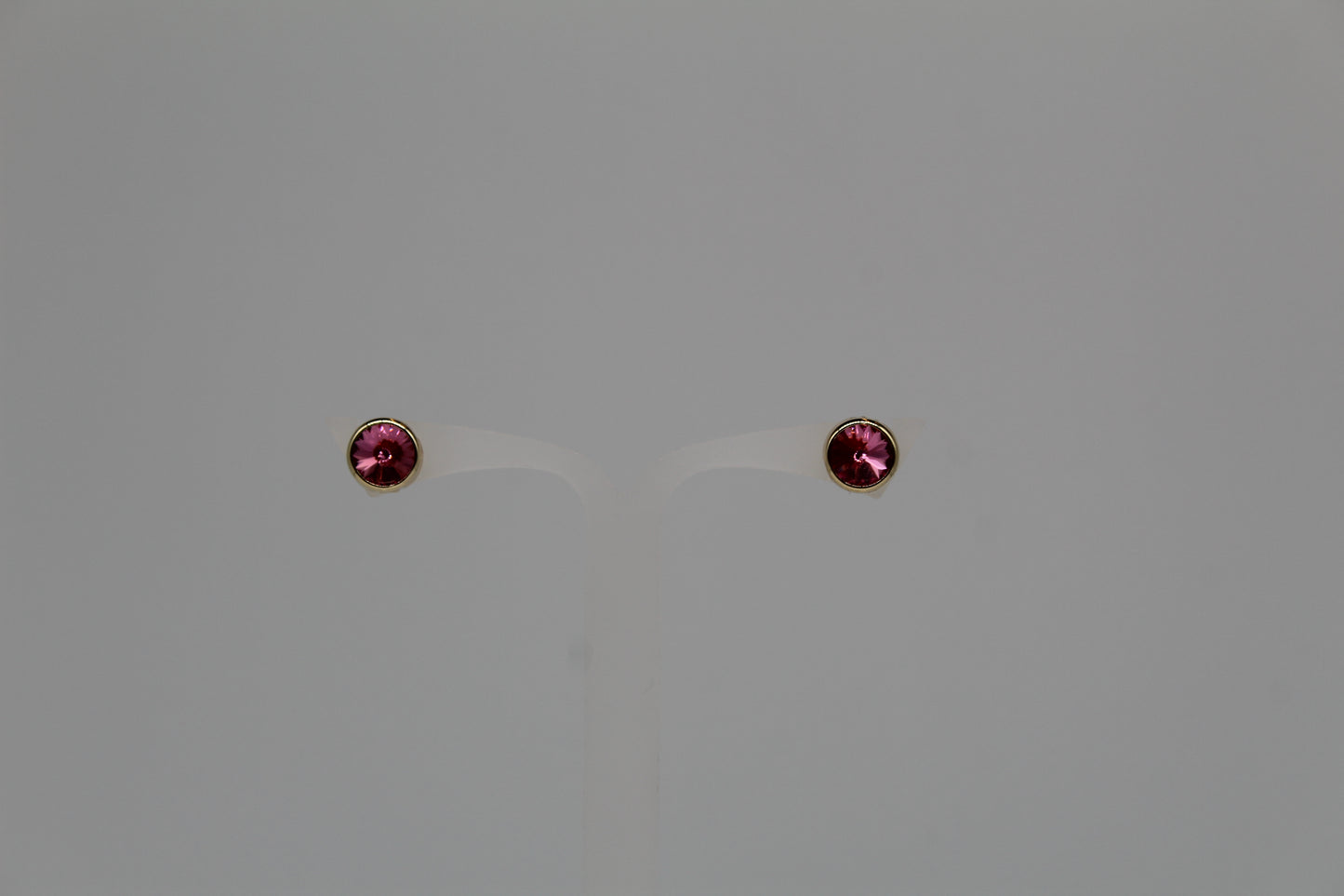 Örhänge med rosa sten